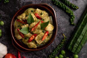 pork-green-curry-brown-bowl-with-spices-black-cement-background_1150-35206 (1)