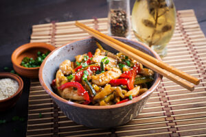 stir-fry-chicken-zucchini-sweet-peppers-green-onion-with-chopsticks (1)